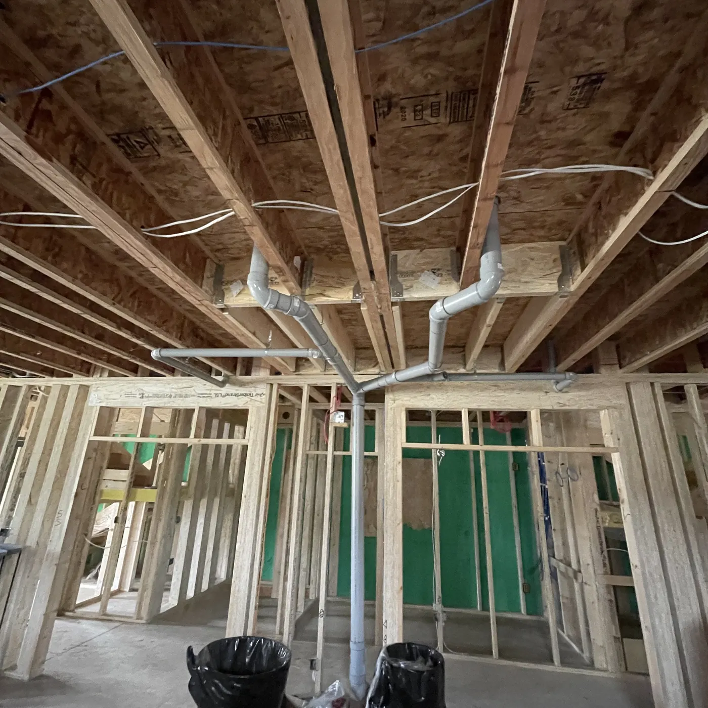 Interior framing and mechanical rough-in photographed during construction