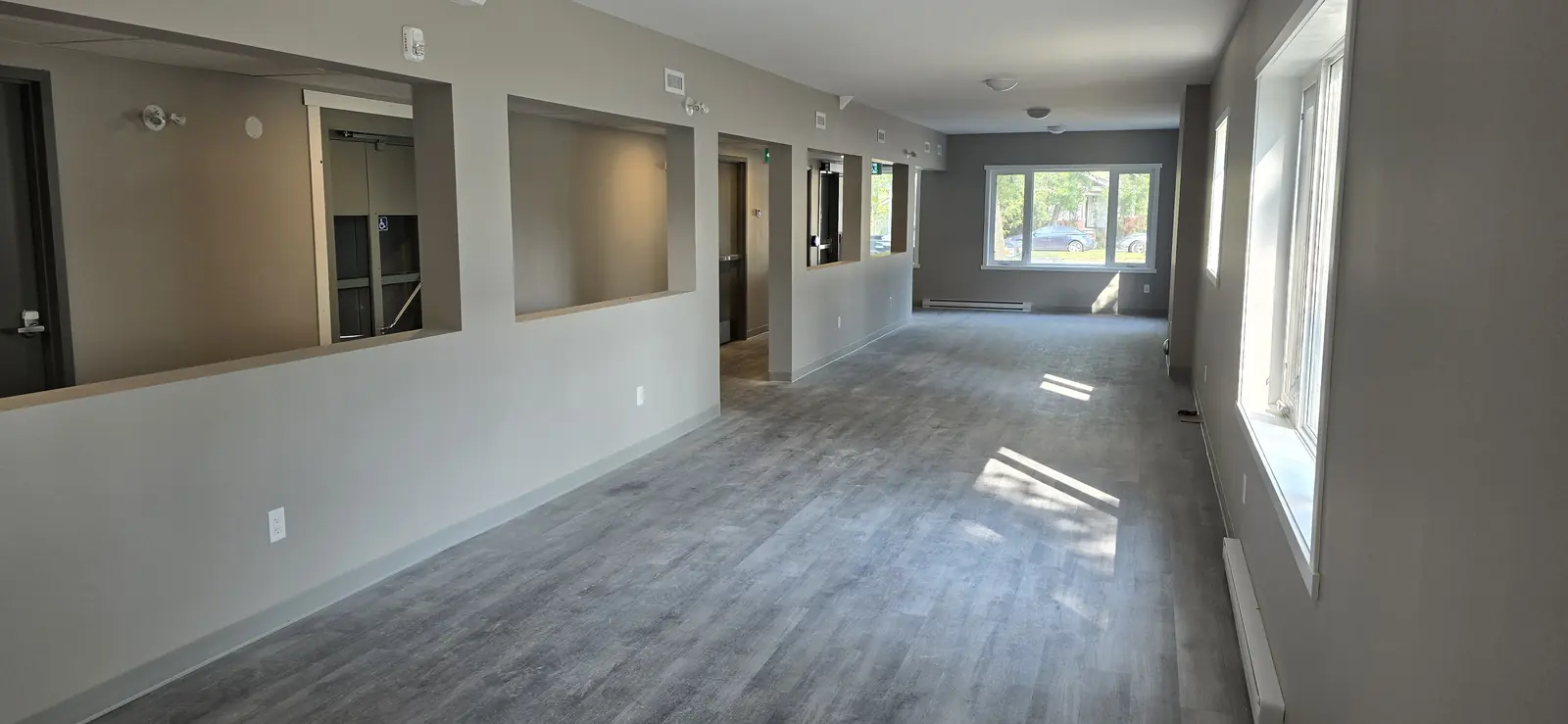 Open-plan room with new flooring and paint