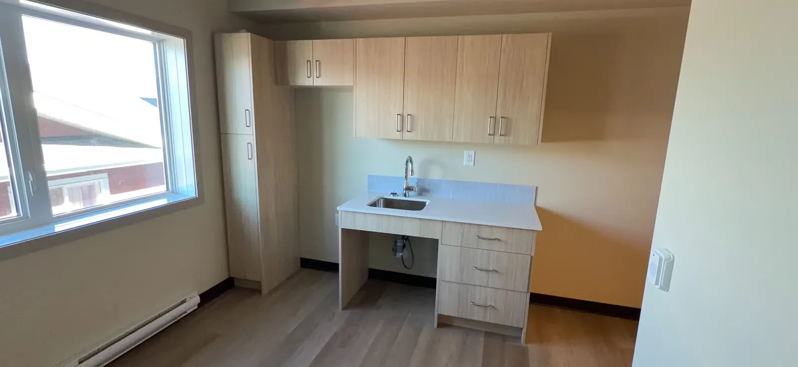 New kitchenette millwork with built-in pantry